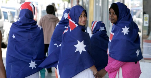 **FILE** A March 21, 2006 file photo of young muslim women modelling Australian flag hijabs as part of national Harmony Day, coinciding with the United Nations Interntional Day for Elimination of Racial Discrimination, in Melbourne. Brisbane radio presenter Michael Smith Thursday, Jan. 15, 2009, called for a ban on Islamic hijabs, saying that they posed a security risk because it obscured the face, making it difficult to identify the wearer in the instance of a crime. (AAP Image/Glenn Hunt, File) NO ARCHIVING